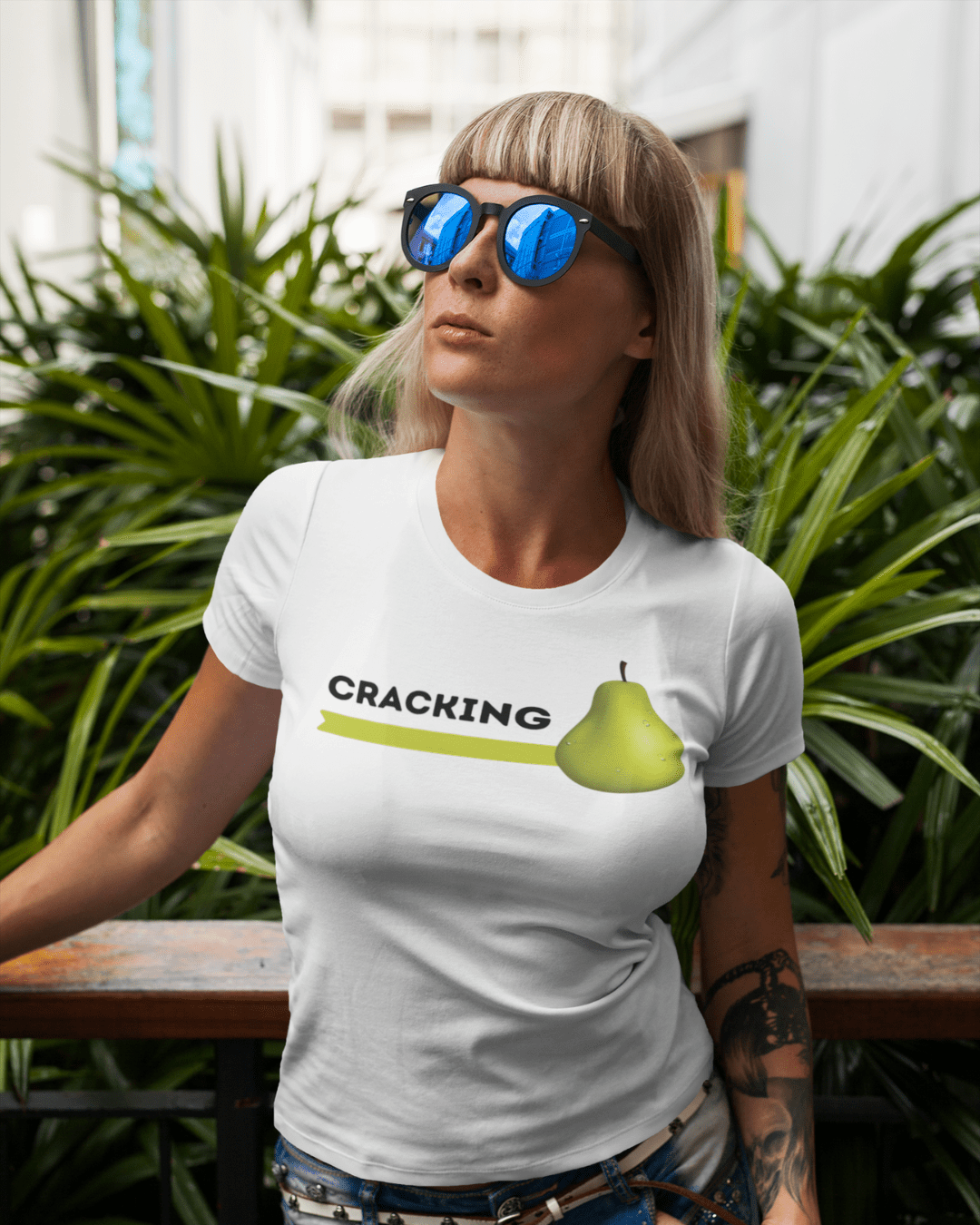 woman wearing funny graphic t-shirt which reads "cracking pear"